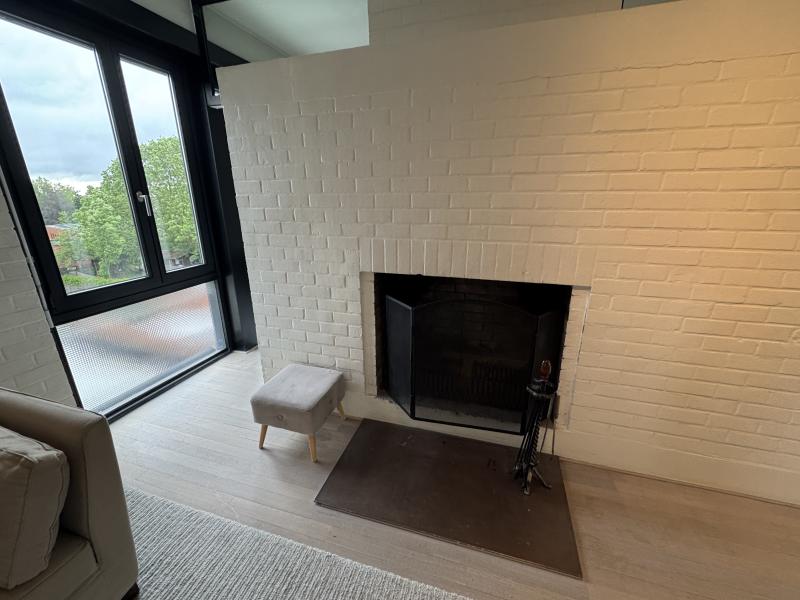 Bright modern penthouse bedroom for student rental, with shared common space, near Howest Kortrijk
